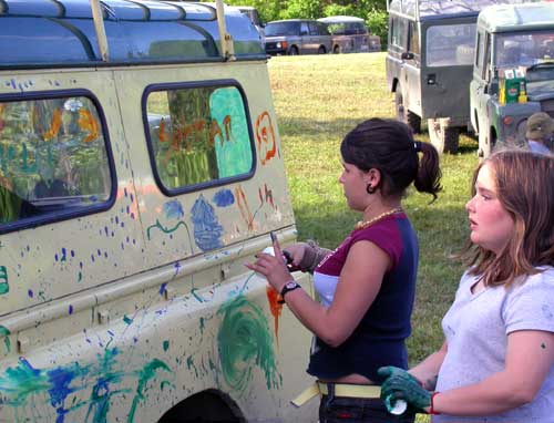 The kids paint a Land Rover